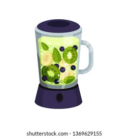 Cocktail with kiwi, banana, blueberries, mint in blue blender.