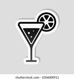 cocktail with lemon slice icon. Sticker style with white border and simple shadow on gray background