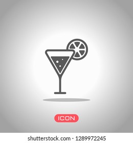 cocktail with lemon slice icon. Icon under spotlight. Gray background