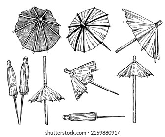 Cocktail umbrella. Cocktail umbrella sketch set. Hand drawn vector illustration isolated on white background.