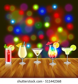 Cocktails on wooden table and bar lights background vector