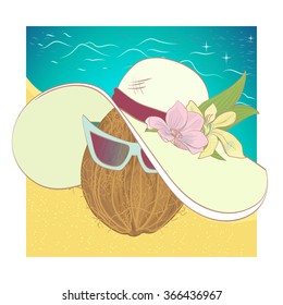 Coconut on the beach against the sea wearing a woman's hat and sunglasses
