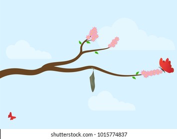 a cocoon of a butterfly on a branch of a flowering tree (sakura) in early spring.