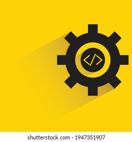 code and gear with shadow on yellow background