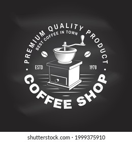 Coffe shop logo, badge template on the chalkboard. Vector. Typography design with coffee grinder silhouette. Template for menu for restaurant, cafe, bar, packaging