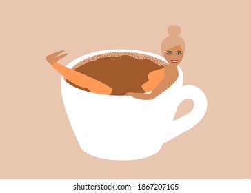 Coffee addiction concept. Woman smiling and bathing in a big coffee mug. 