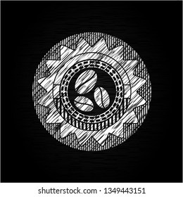 coffee bean icon inside chalkboard emblem written on a blackboard