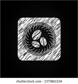 coffee bean icon inside chalkboard emblem on black board