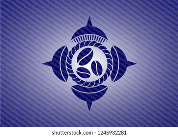 coffee bean icon inside denim background