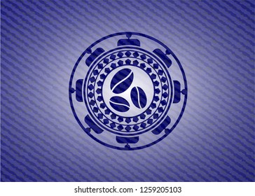 coffee bean icon inside emblem with jean background