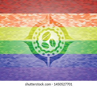 coffee bean icon inside emblem on mosaic background with the colors of the LGBT flag