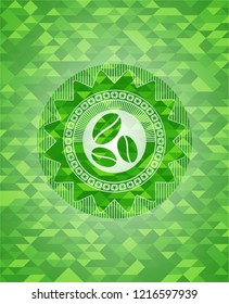 coffee bean icon inside green emblem with triangle mosaic background