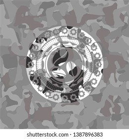 coffee bean icon inside grey camouflage texture