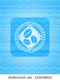 coffee bean icon inside light blue water wave style emblem.