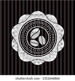 coffee bean icon inside silvery emblem