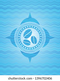 coffee bean icon inside sky blue water wave emblem.
