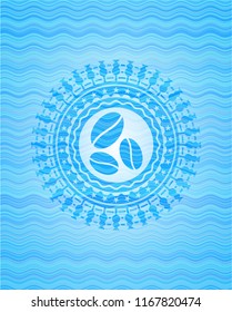 coffee bean icon inside water representation emblem.