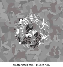 coffee bean icon on grey camouflaged pattern