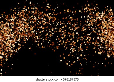 Coffee color grain texture isolated on black background. Chocolate shades confetti. Brown particles