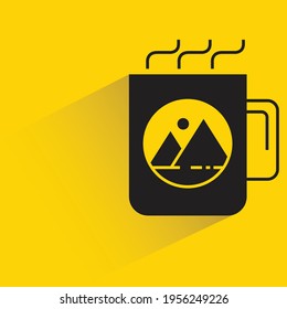 coffee cup with brand label shadow on yellow background