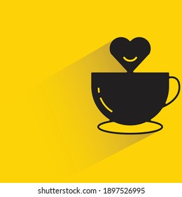 coffee cup with heart shadow on yellow background vector