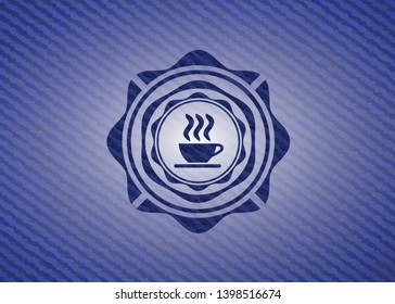 coffee cup icon inside badge with jean texture
