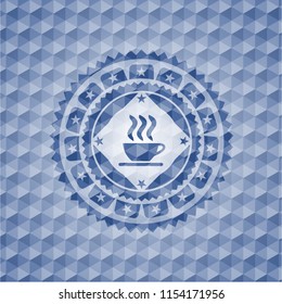 coffee cup icon inside blue hexagon badge.