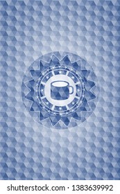coffee cup icon inside blue badge with geometric pattern.