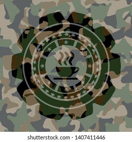 coffee cup icon inside camouflaged emblem