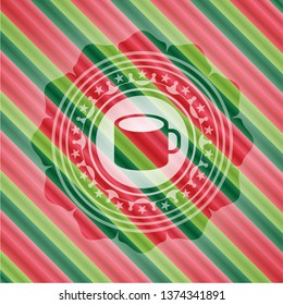 coffee cup icon inside christmas colors badge.