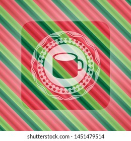 coffee cup icon inside christmas colors badge.