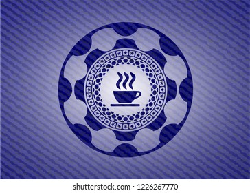 coffee cup icon inside emblem with denim texture