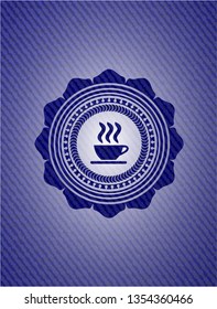 coffee cup icon inside emblem with denim texture