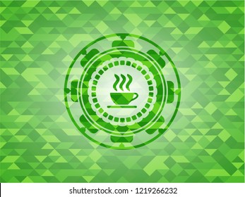 coffee cup icon inside green emblem with triangle mosaic background