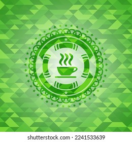 coffee cup icon inside green mosaic emblem. 