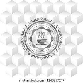 coffee cup icon inside grey badge with geometric cube white background