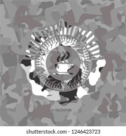 coffee cup icon inside grey camouflage emblem