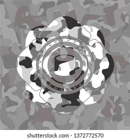coffee cup icon inside grey camouflaged emblem