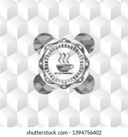 coffee cup icon inside grey badge with geometric cube white background