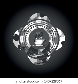 coffee cup icon inside grey camo emblem