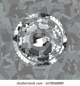 coffee cup icon inside grey camouflage emblem