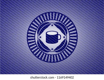 coffee cup icon inside jean or denim emblem or badge background