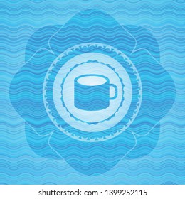 coffee cup icon inside light blue water wave badge.
