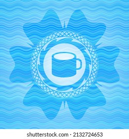 coffee cup icon inside light blue water wave badge. 