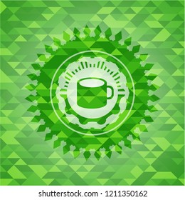 coffee cup icon inside realistic green emblem. Mosaic background