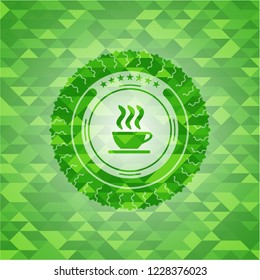 coffee cup icon inside realistic green emblem. Mosaic background