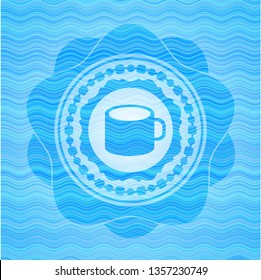 coffee cup icon inside sky blue water wave badge.