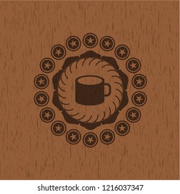 coffee cup icon inside wooden emblem