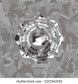 coffee cup icon on grey camouflaged pattern