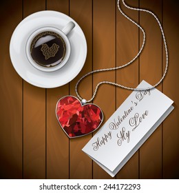 Coffee cup with Letter with pendant on wood background.